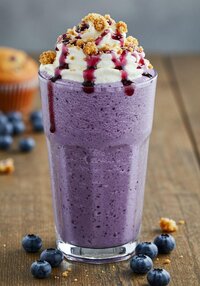 Fresh blueberry milkshake with real berries and cream - fruity delight at Coffee Koffein