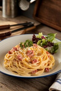 Classic spaghetti pasta with traditional sauce and herbs - Italian favorite at Coffee Koffein