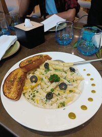 Creamy Alfredo white pasta with rich cheese sauce - comfort food at Coffee Koffein
